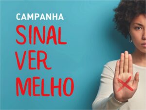 Um X vermelho na mão é um sinal de alerta contra agressão a mulher